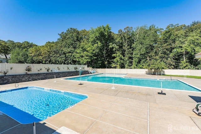 2 Honey Locust Ln, Howell, NJ 07731 - community pool featuring a patio area