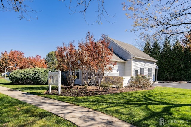2 Honey Locust Ln, Howell, NJ 07731 - view of home's exterior featuring a lawn