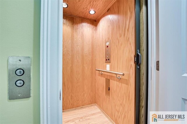 details featuring wooden ceiling and elevator