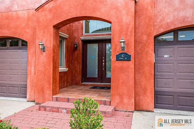 doorway to property featuring a garage