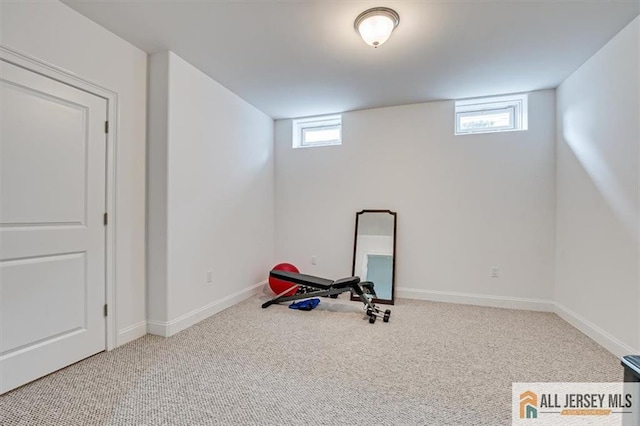 workout room with plenty of natural light and carpet