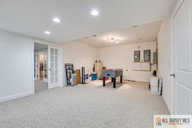 playroom featuring light carpet, electric panel, and french doors