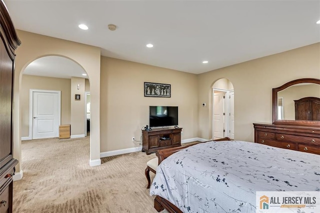 bedroom with light colored carpet