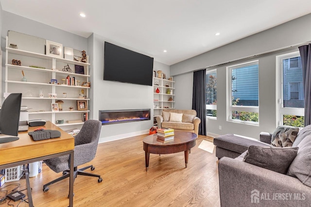 office space with light wood-type flooring