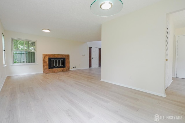14 Carriage Pl, Edison, NJ 08820 - unfurnished living room featuring a high end fireplace and light wood-style floors