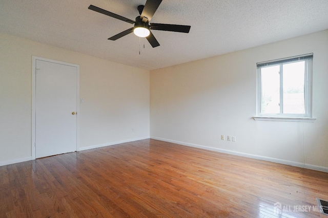 14 Carriage Pl, Edison, NJ 08820 - unfurnished room featuring wood finished floors, a ceiling fan, and a textured ceiling