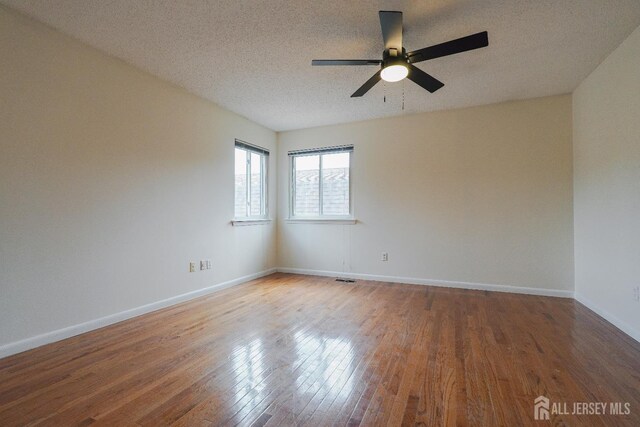 14 Carriage Pl, Edison, NJ 08820 - unfurnished room with wood finished floors, ceiling fan, and a textured ceiling