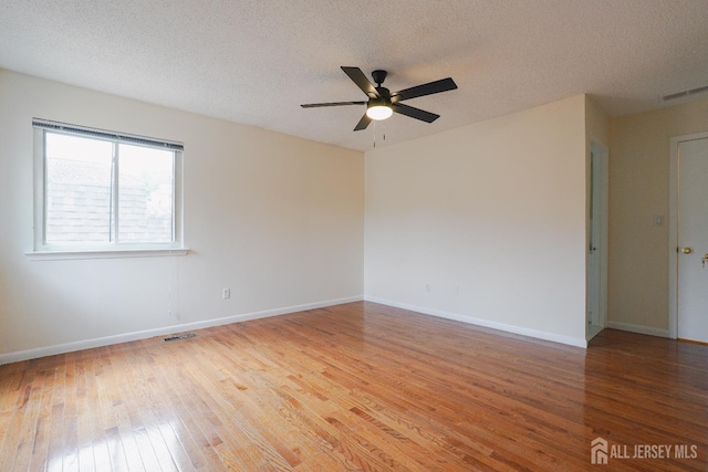 14 Carriage Pl, Edison, NJ 08820 - spare room with light wood-style floors, a ceiling fan, and a textured ceiling