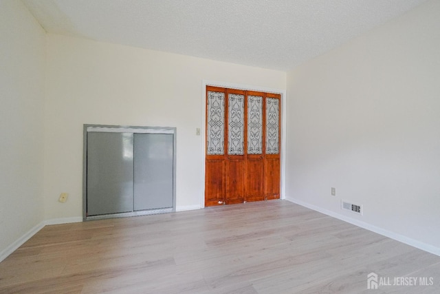 14 Carriage Pl, Edison, NJ 08820 - empty room with light wood finished floors and baseboards