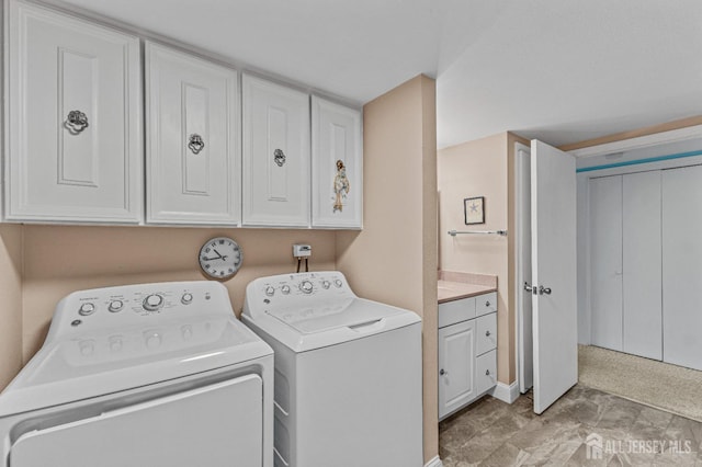 laundry room with cabinet space and independent washer and dryer