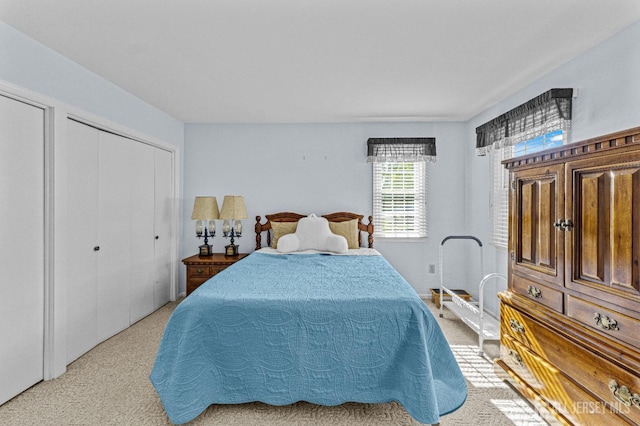 bedroom featuring light carpet