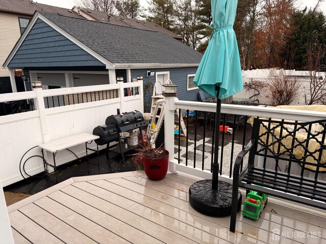 wooden deck featuring grilling area