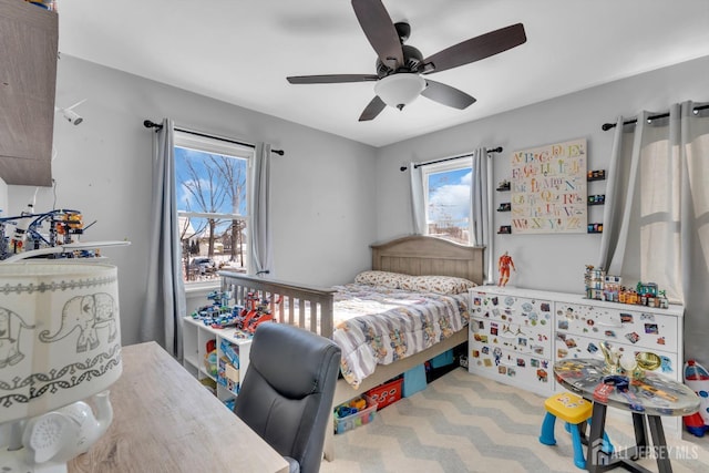 carpeted bedroom featuring ceiling fan