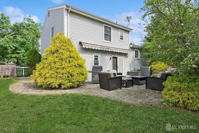 back of property featuring an outdoor hangout area, a patio, fence, and a lawn