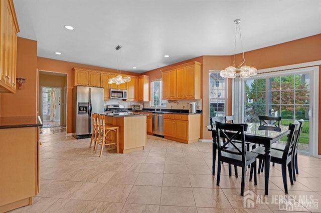 65 Cortland Dr, East Brunswick, NJ 08816 - kitchen featuring a chandelier, stainless steel appliances, dark countertops, a center island, and recessed lighting