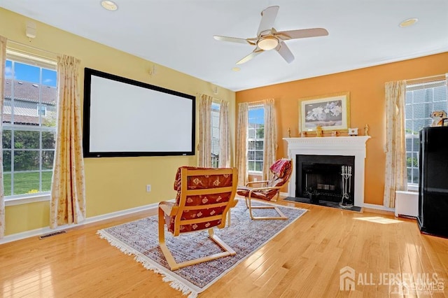 65 Cortland Dr, East Brunswick, NJ 08816 - sitting room with wood finished floors, healthy amount of natural light, a fireplace, and recessed lighting
