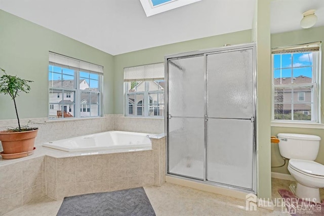 65 Cortland Dr, East Brunswick, NJ 08816 - bathroom featuring a skylight, a bath, a shower stall, and tile patterned floors