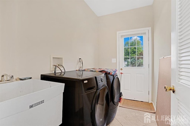 65 Cortland Dr, East Brunswick, NJ 08816 - washroom with washing machine and clothes dryer and light tile patterned floors