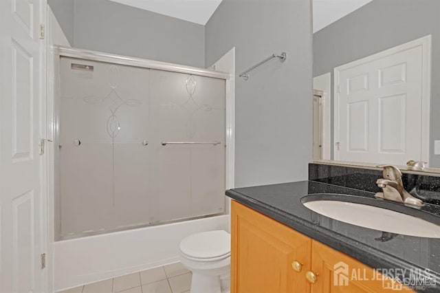65 Cortland Dr, East Brunswick, NJ 08816 - bathroom featuring vanity, tile patterned flooring, and bath / shower combo with glass door