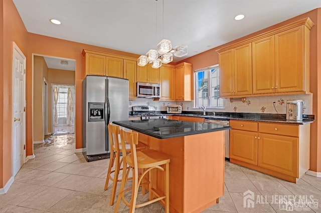 65 Cortland Dr, East Brunswick, NJ 08816 - kitchen featuring stainless steel appliances, a chandelier, a kitchen island, light tile patterned floors, and recessed lighting