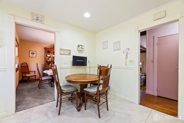 dining space with recessed lighting and baseboards