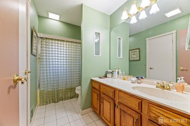 bathroom with tile patterned floors, vanity, toilet, and a shower with shower curtain