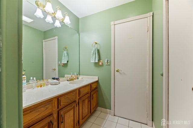 bathroom with tile patterned flooring and vanity