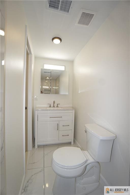 15 Wedgewood Ave, Woodbridge Proper, NJ 07095 - bathroom with visible vents, toilet, marble finish floor, and baseboards