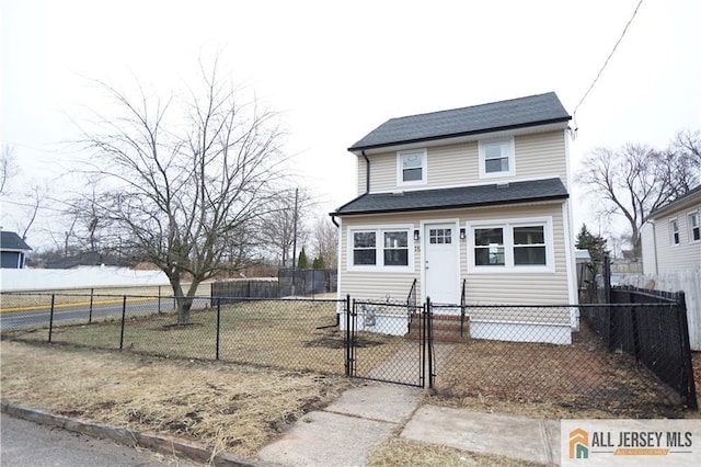 15 Wedgewood Ave, Woodbridge Proper, NJ 07095 - traditional-style house with a gate and a fenced front yard