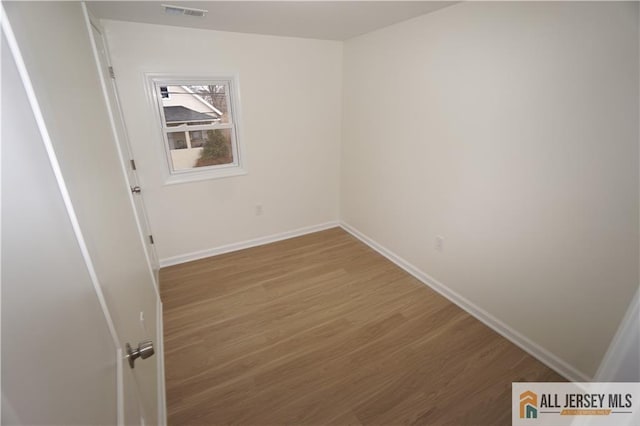 15 Wedgewood Ave, Woodbridge Proper, NJ 07095 - spare room with baseboards, wood finished floors, and visible vents
