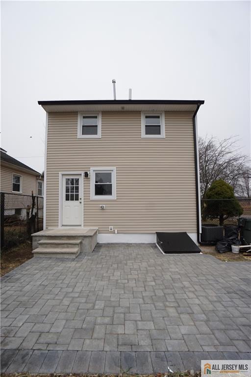 15 Wedgewood Ave, Woodbridge Proper, NJ 07095 - rear view of property with a patio area and fence