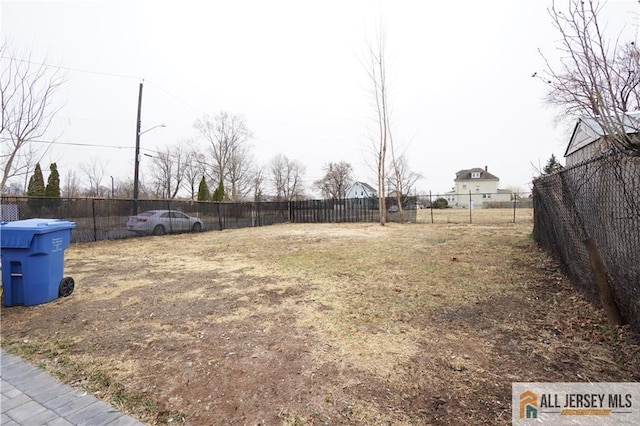 view of yard featuring fence