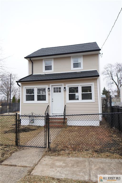 view of front of property with a fenced front yard and a gate