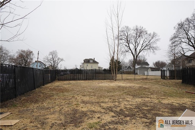 view of yard featuring fence