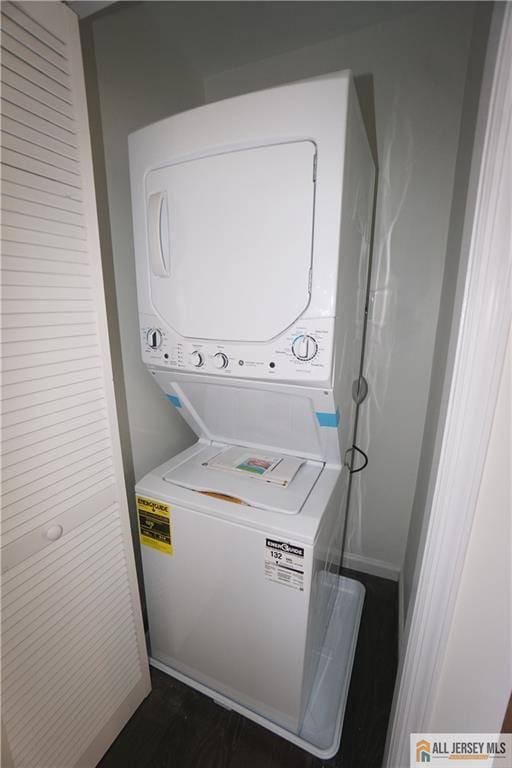 laundry room featuring laundry area and stacked washing maching and dryer