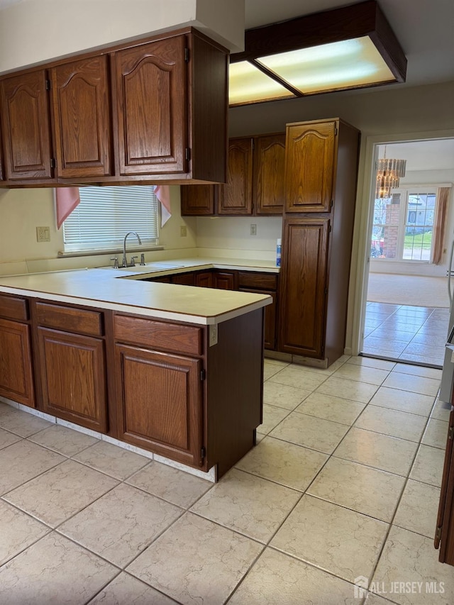 93 Mansfield Ave, Manchester, NJ 08579 - kitchen with light countertops, a peninsula, and light tile patterned flooring