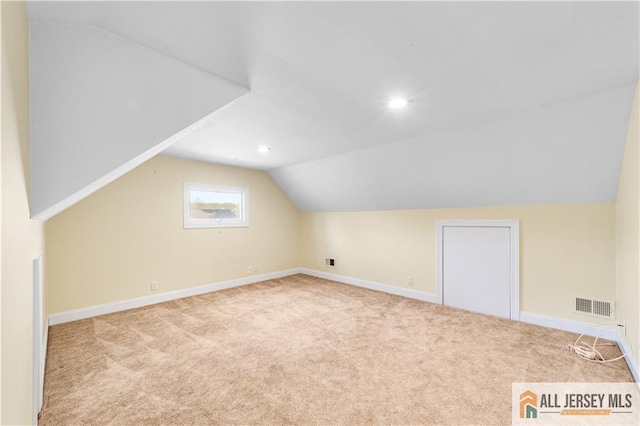 bonus room with vaulted ceiling, carpet, baseboards, and recessed lighting
