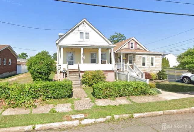 view of front of property with a porch and stone siding