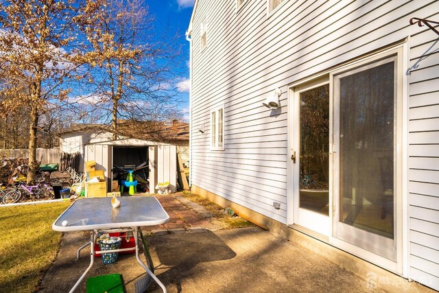 view of patio / terrace with a storage shed