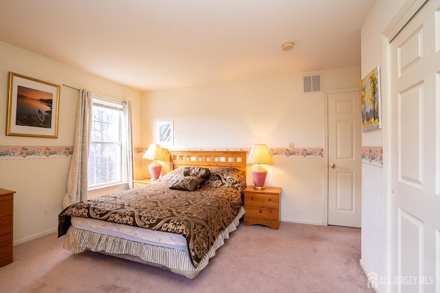 bedroom featuring light colored carpet