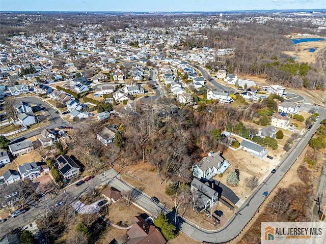 birds eye view of property with a residential view