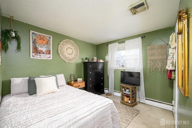 bedroom with a baseboard radiator, visible vents, and carpet flooring