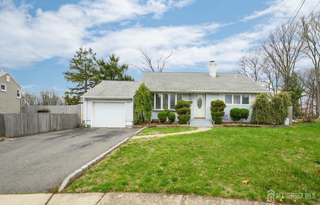 ranch-style house featuring a chimney, aphalt driveway, fence, an attached garage, and a front yard