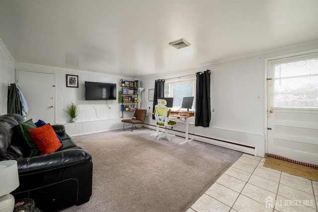 living area with crown molding, visible vents, tile patterned floors, and a wealth of natural light