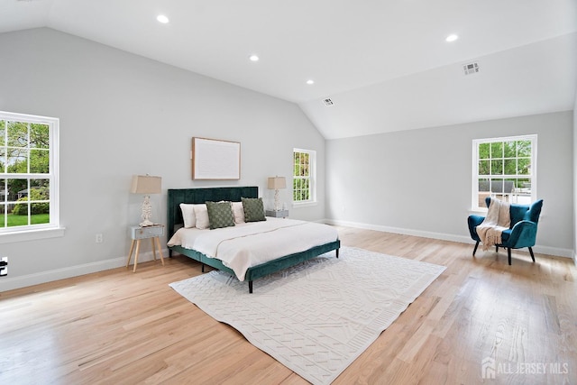 695 Inman Ave, Colonia, NJ 07067 - bedroom with lofted ceiling, multiple windows, light wood-style floors, and recessed lighting