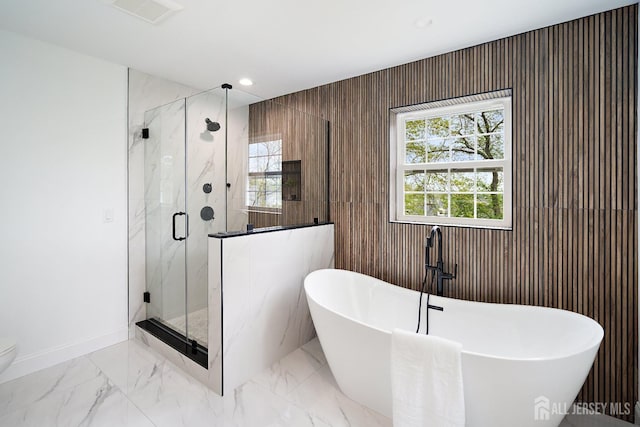 695 Inman Ave, Colonia, NJ 07067 - bathroom with a freestanding tub, a marble finish shower, marble finish flooring, and recessed lighting