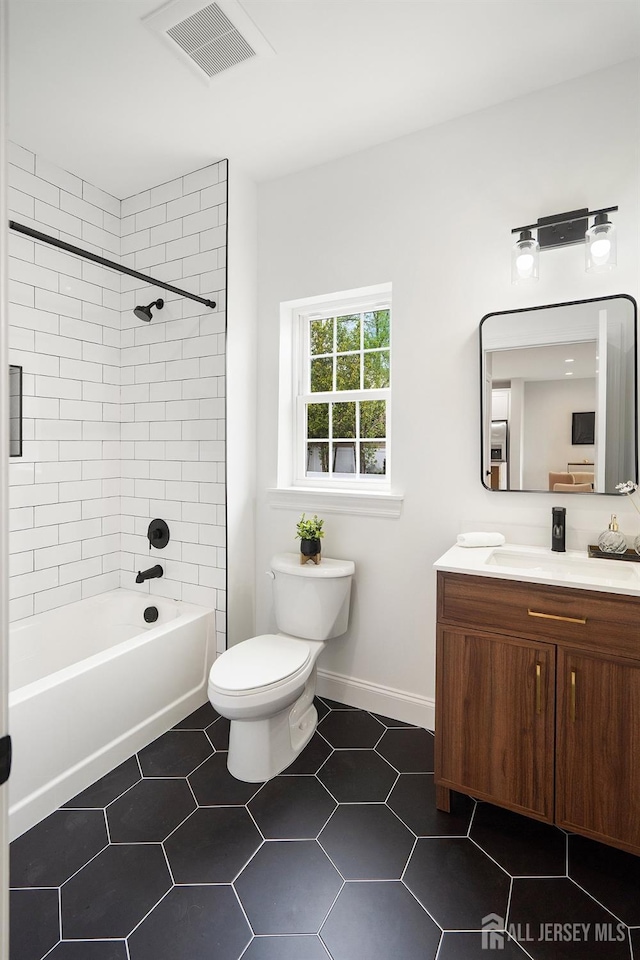 695 Inman Ave, Colonia, NJ 07067 - full bathroom featuring vanity, shower / bath combination, and tile patterned floors