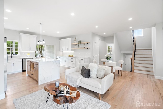 695 Inman Ave, Colonia, NJ 07067 - living area featuring stairway, light wood-style flooring, and recessed lighting