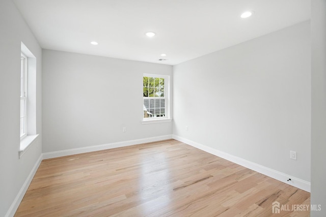 695 Inman Ave, Colonia, NJ 07067 - empty room featuring light wood-type flooring and recessed lighting