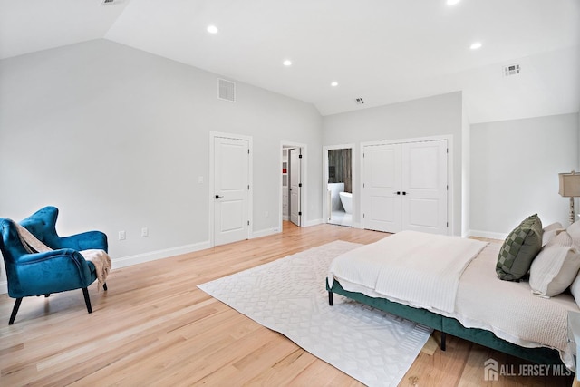 695 Inman Ave, Colonia, NJ 07067 - bedroom featuring vaulted ceiling, light wood-type flooring, recessed lighting, a closet, and ensuite bath